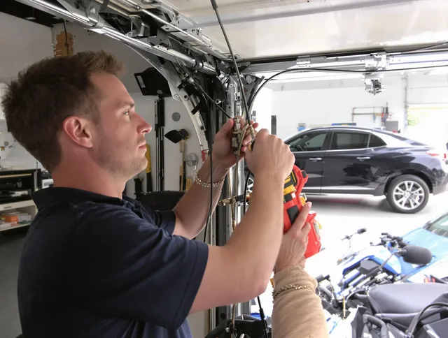 Bonita Springs Garage Door Repair safety certified technician performing cable replacement in Bonita Springs